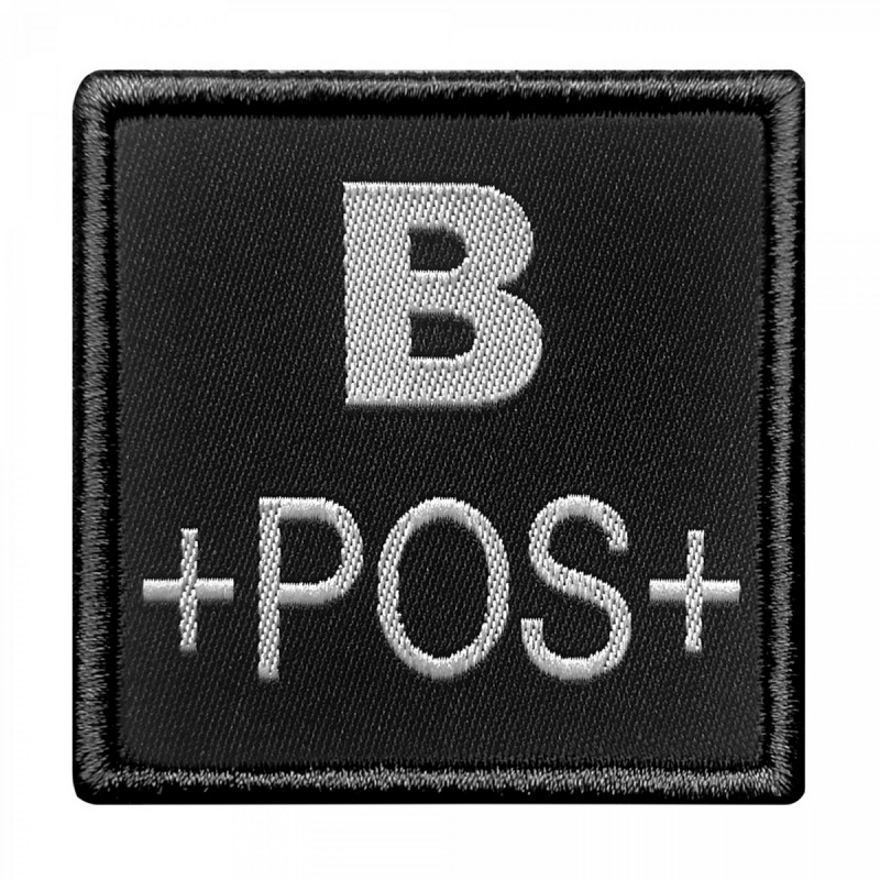 Groupe sanguin B positif brodé sur tissu noir Groupe sanguin B positif brodé sur tissu noir