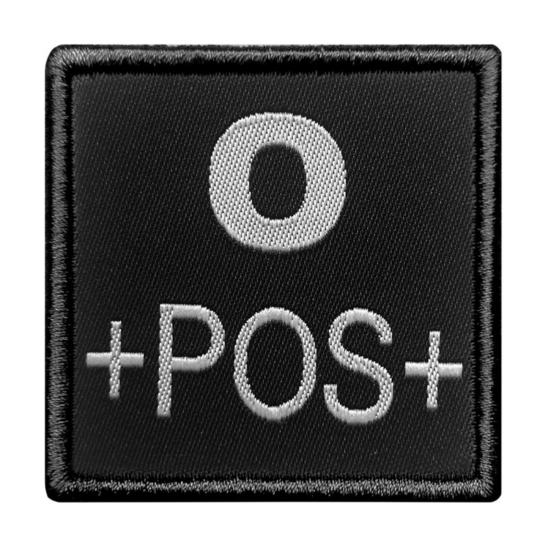 Groupe sanguin O positif brodé sur tissu noir Groupe sanguin O positif brodé sur tissu noir
