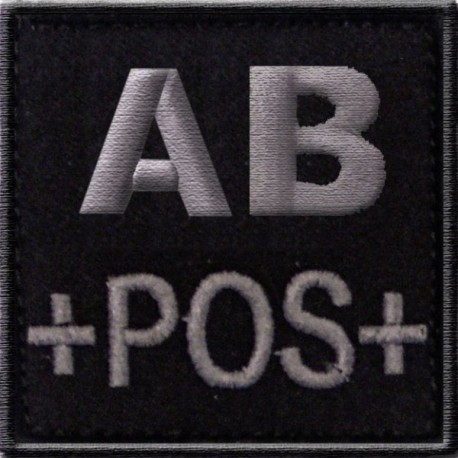 Groupe sanguin AB positif brodé sur tissu noir